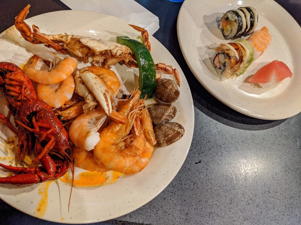Rows of buffet trays in a casual restaurant.